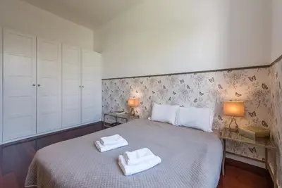 a bedroom with a bed with two towels on it at GuestReady - Cityscape coastal flat in Porto