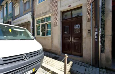 a white van parked in front of a building at Oporto Blue Almada - Deluxe Citycenter Flat in Porto