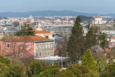 a view of a city with a building and trees at GuestReady - Candal Big Watch in Vila Nova de Gaia
