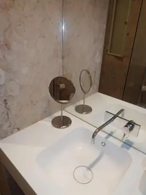 a bathroom sink with a mirror and a sink at ML Apartments Almada Living in Porto
