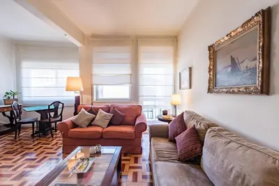 a living room with a couch and a table at GuestReady - Urban escape in Porto in Porto