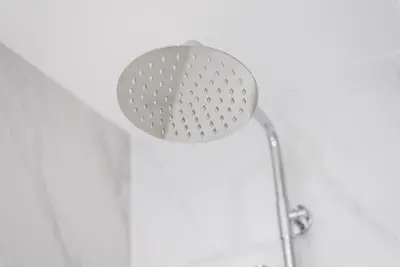 a shower with a shower head in a bathroom at GuestReady - Tigerlily in Porto