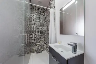 a bathroom with a sink and a shower at GuestReady - Redamancy Flat in Porto