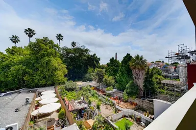 an overhead view of a park with trees and buildings at Nomad's Easy Stay - 1BED Sunrise Cedofeita in Porto