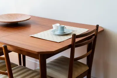 a wooden table with a cup and a plate on it at Beauty Porto in Porto