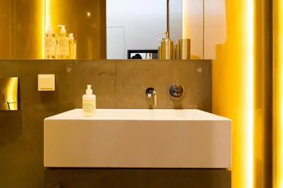 a bathroom sink with a soap bottle on it at Beauty Porto in Porto