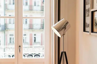 a lamp in a room with a window at Beauty Porto in Porto