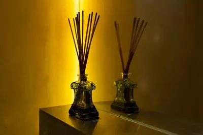 two vases sitting on a table with a light at Beauty Porto in Porto
