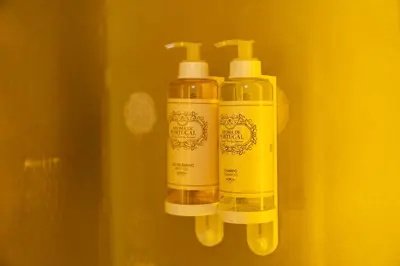 two bottles ofodorizers are hanging on a wall at Beauty Porto in Porto