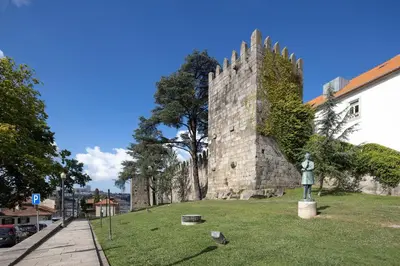 a building with a statue in front of it at CASA JOY Cathedral apartment in Porto