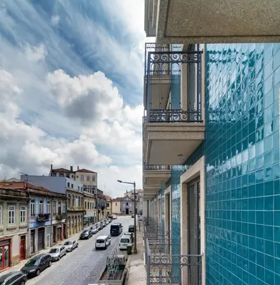 a city street with cars parked on the side of a building at Oca Oriental Porto Hotel in Porto