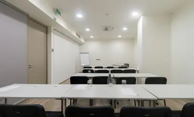 a conference room with tables and chairs in it at Oca Oriental Porto Hotel in Porto