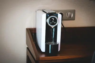 a black and white appliance sitting on a shelf at Oca Oriental Porto Hotel in Porto