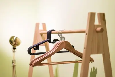 a wooden chair with a strap on the back of it at GuestReady - Miragaia Green in Porto