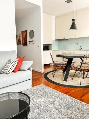 a living room with a couch and a table at Impar luxury residence in Porto