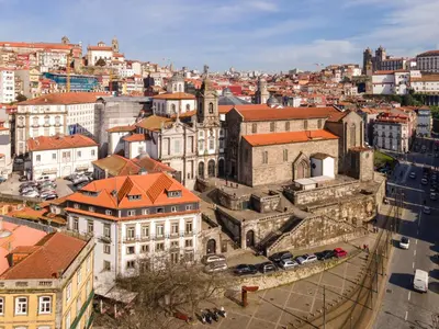 an aerial view of a city with buildings and cars at Memoria Porto FLH Hotels in Porto