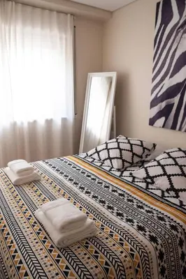 a bedroom with two beds with towels on them at Ninho @ Francos in Porto