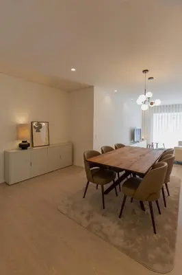 a dining room with a wooden table and chairs at ORM Antero Apartment in Porto