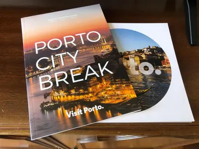 a book on the cover of a paronto city break at Invicta Republica Studio in Porto