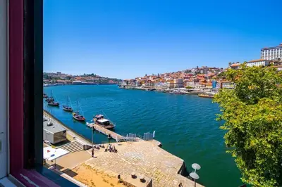 a view of a river with boats in the water at NorteSoul Porto à Vista in Vila Nova de Gaia
