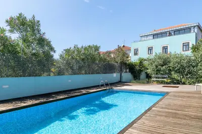 a swimming pool in the backyard of a house at North Side in Porto