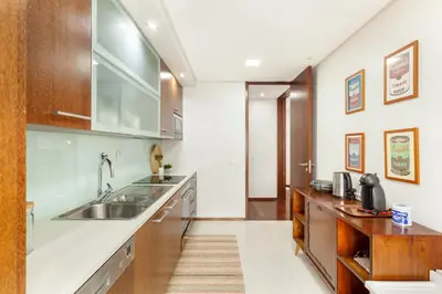 a kitchen with a sink and a counter at D&S - Family Apartments II in Porto