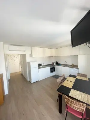 a kitchen and dining room with a table and chairs at Portoo Blue Apartments - Douro in Vila Nova de Gaia
