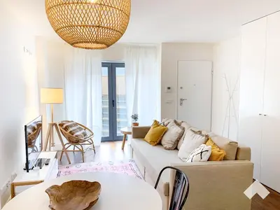 a living room with a couch and a table at The Wondrous Central Apartment in Porto