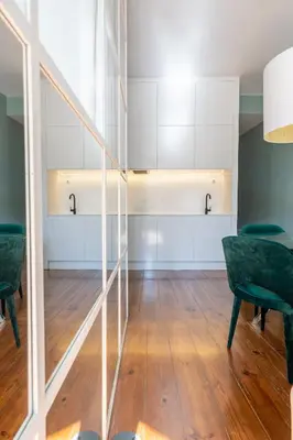 a dining room with a table and chairs at CLUBE Charming Apartments - Ribeira in Porto