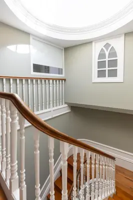 an image of a hallway with a door and stairs at CLUBE Charming Apartments - Ribeira in Porto