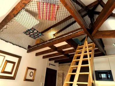 a room with a ceiling with wooden beams at Framer's House - Authentic Downtown in Porto