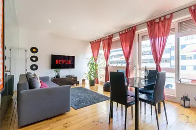 a living room with a couch and a table at Sunny Oporto, Trindade Balcony in Porto
