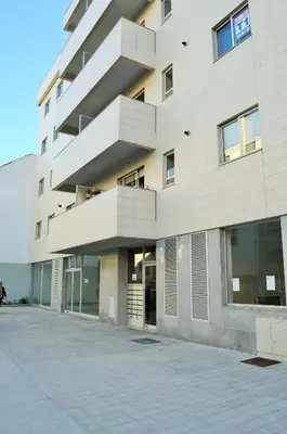a tall white building with a lot of windows at Musical View in Porto