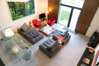 an overhead view of a living room with couches and chairs at Arty Porto in Porto