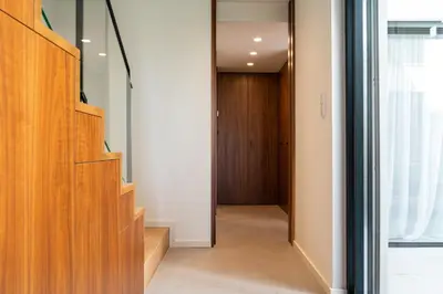 a hallway with wood cabinets and a door at Arty Porto in Porto