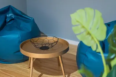 a table with a net on it next to a plant at GuestReady - Miragaia Rooftop in Porto