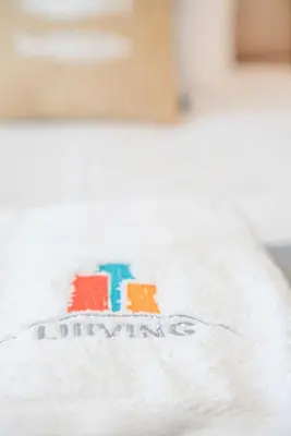 a white towel with the word amazon written on it at Liiiving in Porto - Carlos Alberto Apartment in Porto