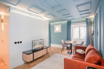 a living room with a couch and a table at Liiiving in Porto - Ribeira Design Apartment in Porto