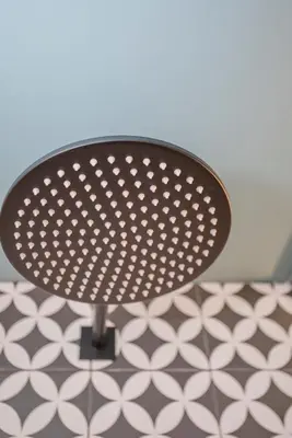 a black table with white polka dots on it at Liiiving in Porto - Ribeira Design Apartment in Porto