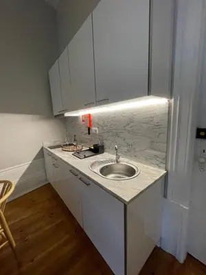 a bathroom with a sink and a white counter top at Formosa Apartments in Porto