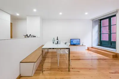 a kitchen with a dining table and a window at GuestReady - Green Bay Garden in Porto