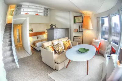 a living room with a couch and a table at Three Houses & Bedrooms in Porto
