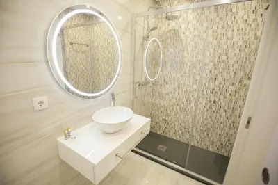 a bathroom with a sink and a mirror at Golden & Blue House, o seu novo espaço no Porto in Porto