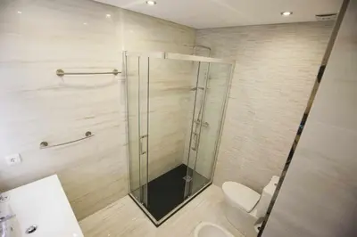 a bathroom with a shower with a toilet and a sink at Golden & Blue House, o seu novo espaço no Porto in Porto