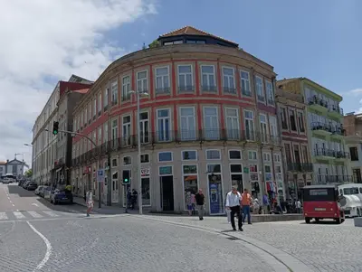 a large building on the corner of a city street at Appartement Pont Luiz in Porto