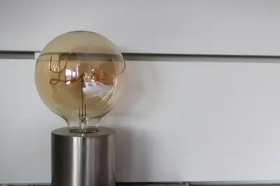a light bulb sitting on top of a metal pole at Estúdio Corujeira in Porto