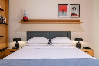 two doors in a room with a basket on a stool at BFRESH Hotel - Padel, Pool & Fitness - Adults Only in Porto