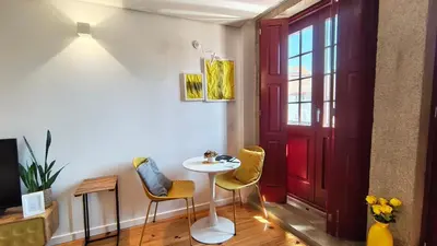 a large white door in a room with a wooden floor at Domus 21 - Batalha in Porto