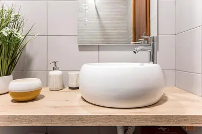 a white sink on a counter in a bathroom at 2BR Flat in Bonfim w/ AC & Balcony by LovelyStay in Porto