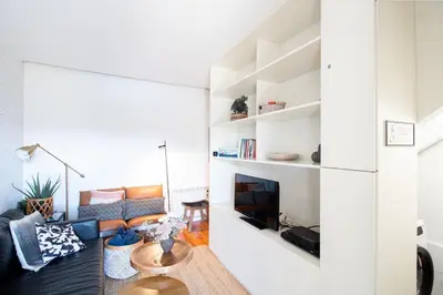 a living room with a couch and a fireplace at Luxurious Townhome with River View by LovelyStay in Porto